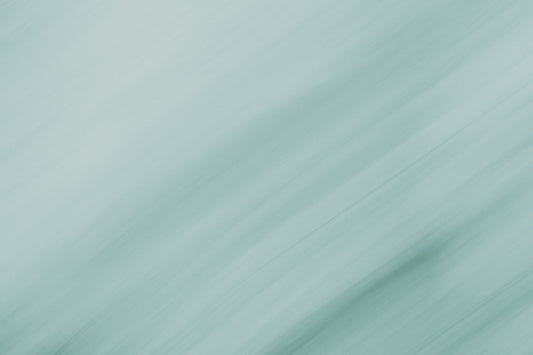 A blurry photo of a green and white background